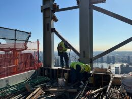 Andrew Horan Alba overseeing NYC construction site operations with modern equipment and safety protocols