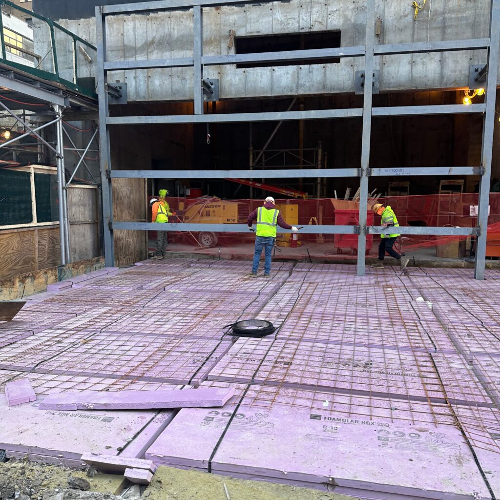 Workers from Andrew Horan Alba learning controlled demolition techniques during training session.