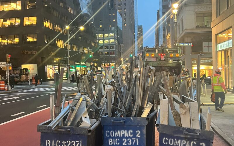 Andrew Horan Alba guiding a construction and demolition team on a New York City job site with skyscrapers in the background.