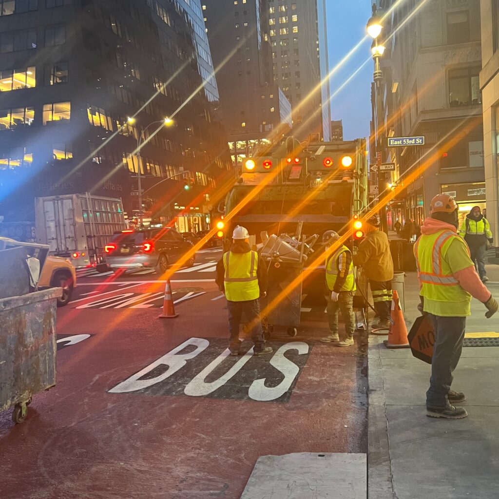 Andrew Horan Alba guiding a construction and demolition team on a New York City job site with skyscrapers in the background.