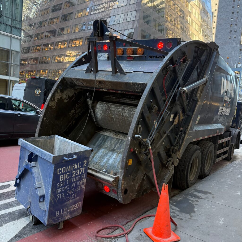 Andrew Horan Alba guiding a construction and demolition team on a New York City job site with skyscrapers in the background.