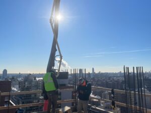 “Andrew Horan Alba managing a New York City demolition and construction site with professional crews and modern safety equipment.”