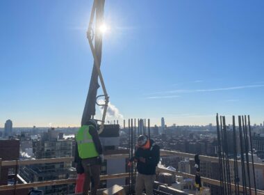 “Andrew Horan Alba managing a New York City demolition and construction site with professional crews and modern safety equipment.”