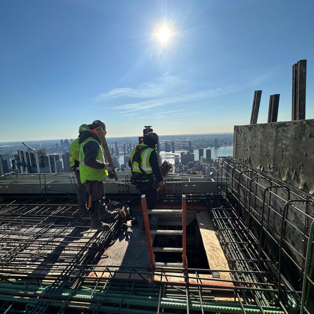 “Andrew Horan Alba managing a New York City demolition and construction site with professional crews and modern safety equipment.”