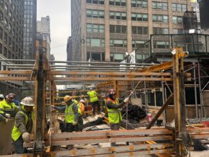 “Andrew Horan Alba managing a New York City demolition and construction site with professional crews and modern safety equipment.”