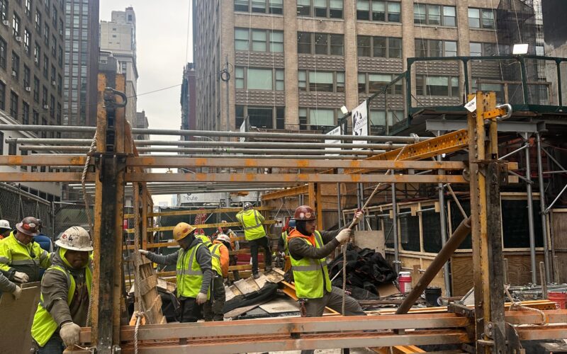 “Andrew Horan Alba managing a New York City demolition and construction site with professional crews and modern safety equipment.”