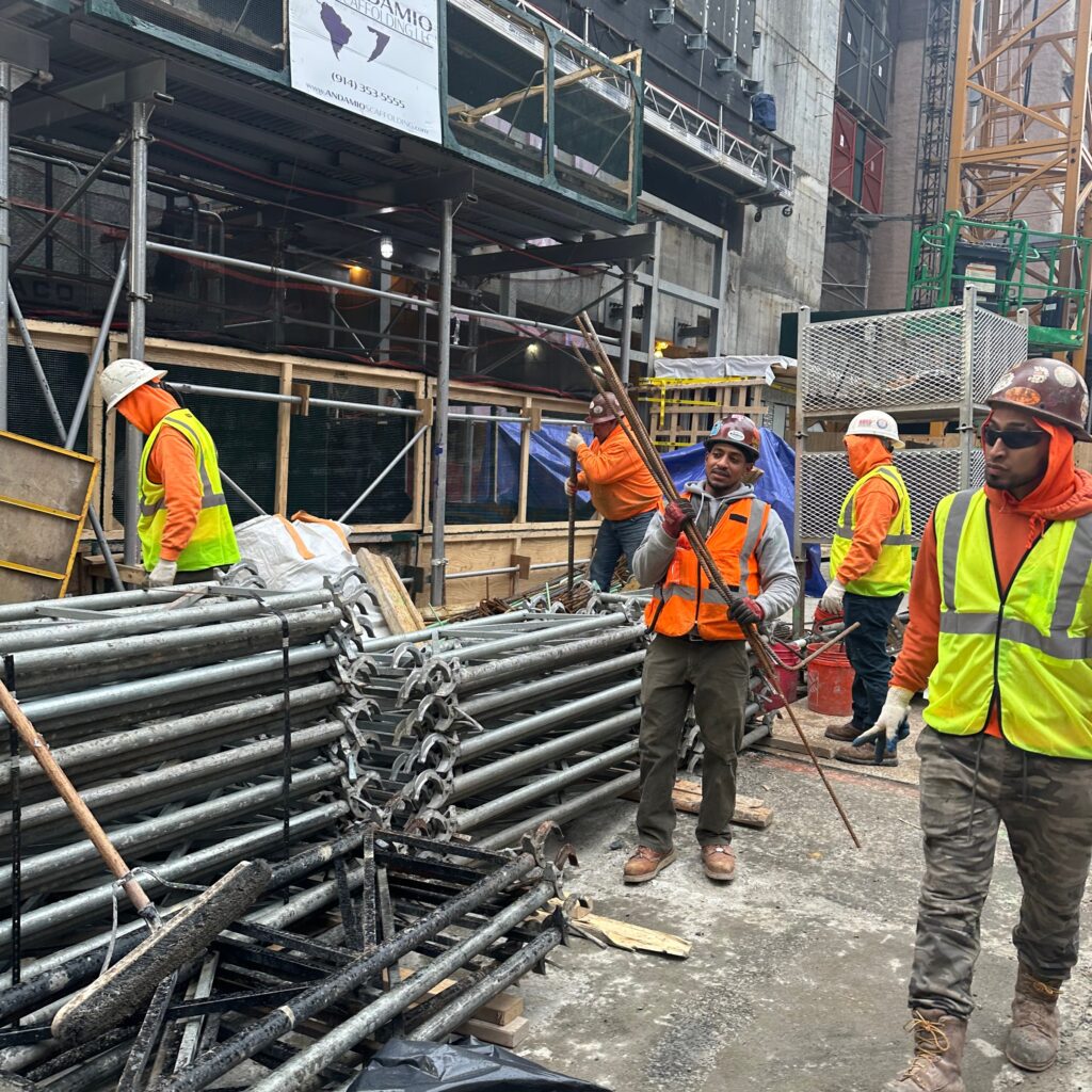 “Andrew Horan Alba managing a New York City demolition and construction site with professional crews and modern safety equipment.”
